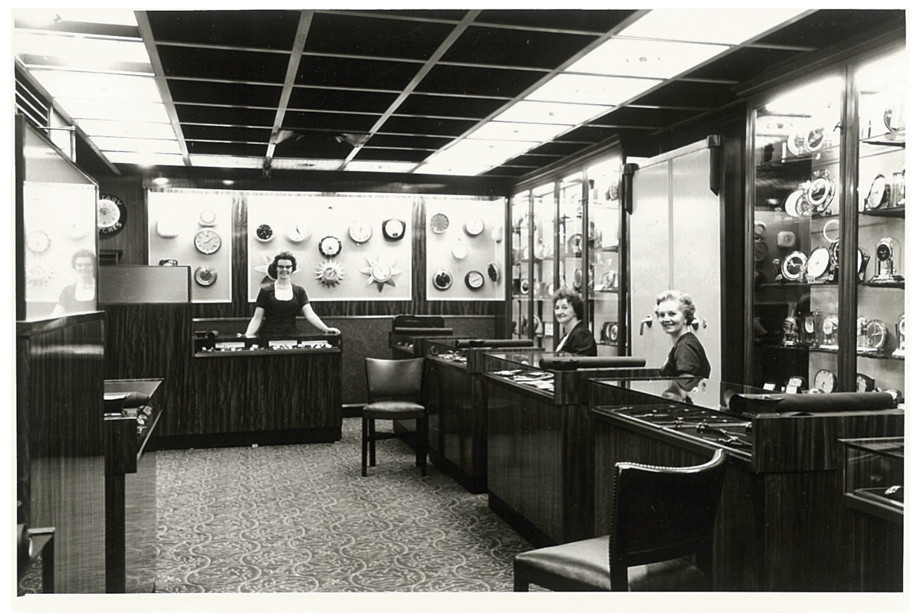 Historic black and white image of three women working in James Porter & Son